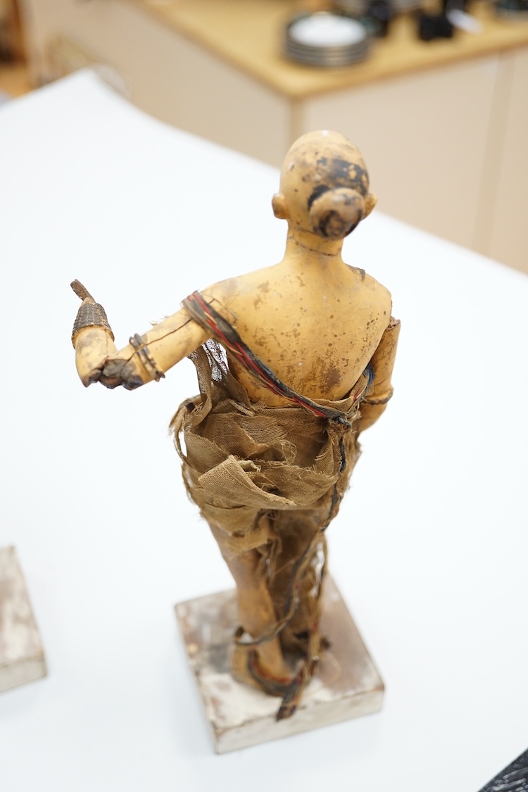 Two Indian clay figures, 26cm high